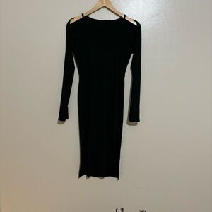 Black long sleeve dress with cutouts at the shoulder